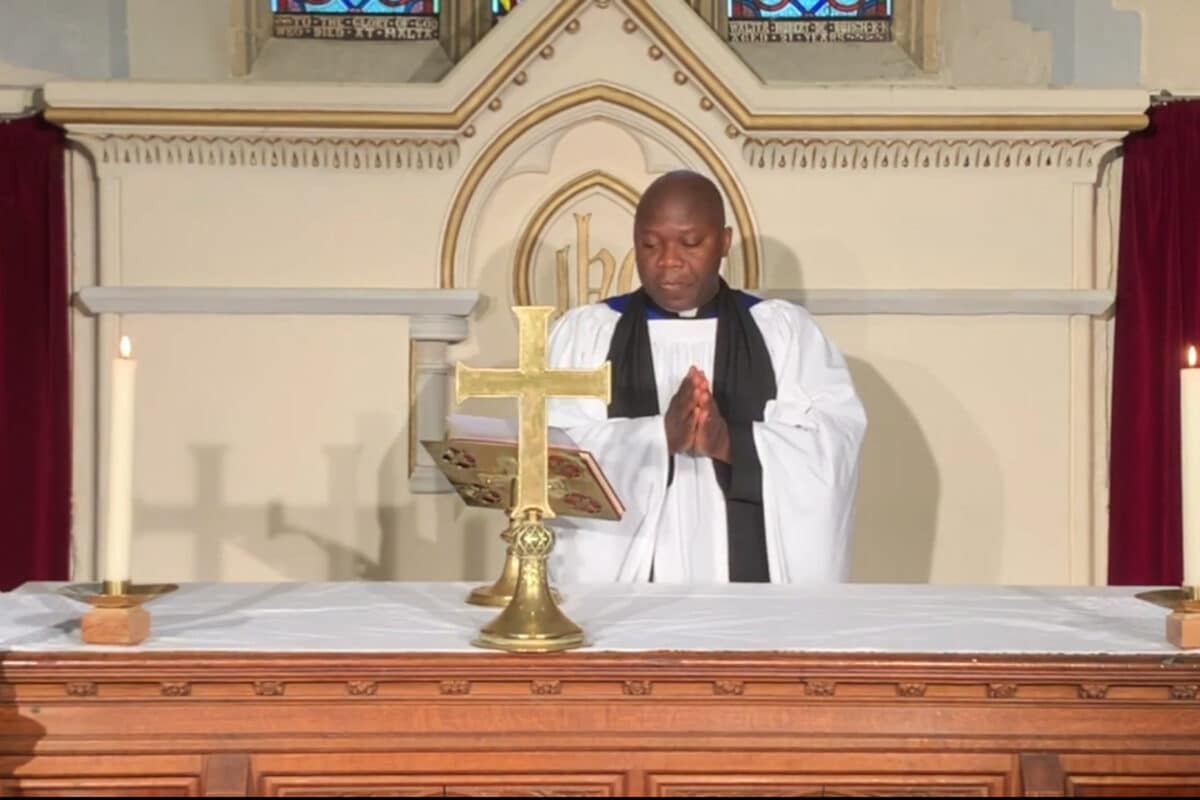 Vicar behind alter