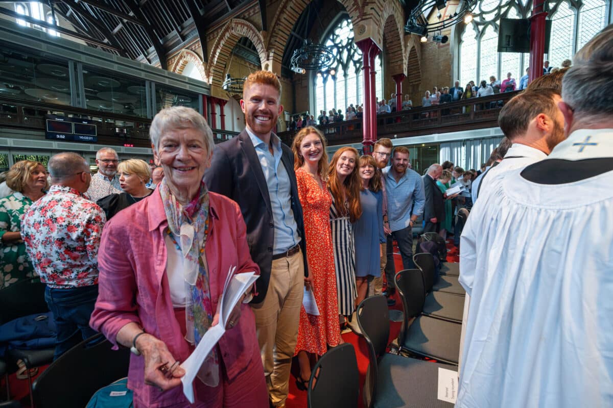 Image of smiling people in church