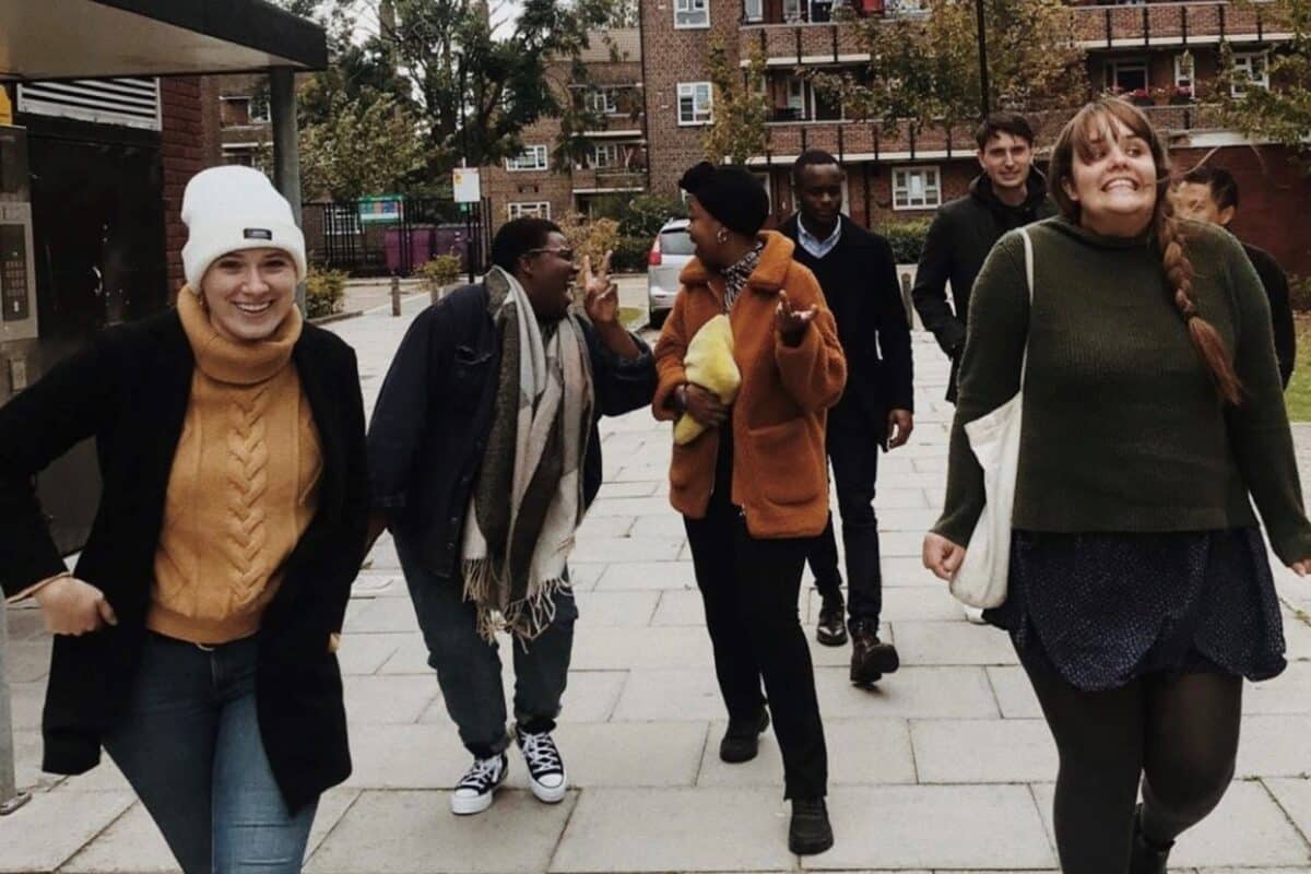 A group of young people walking and laughing