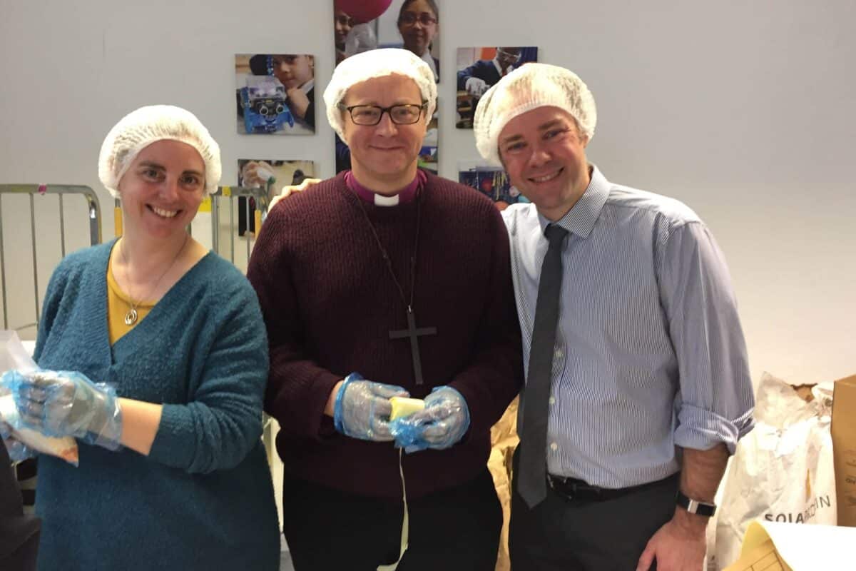 Bishop Rob lends a hand with Feed the Hungry at Barnet School.