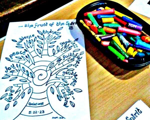 Crayons and adult colouring in sheets.