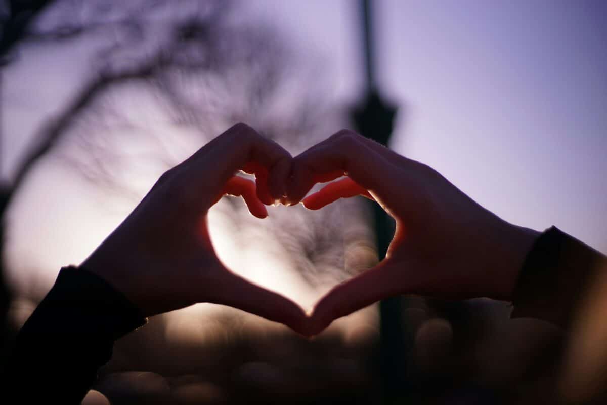 Photo of hands making a heart.