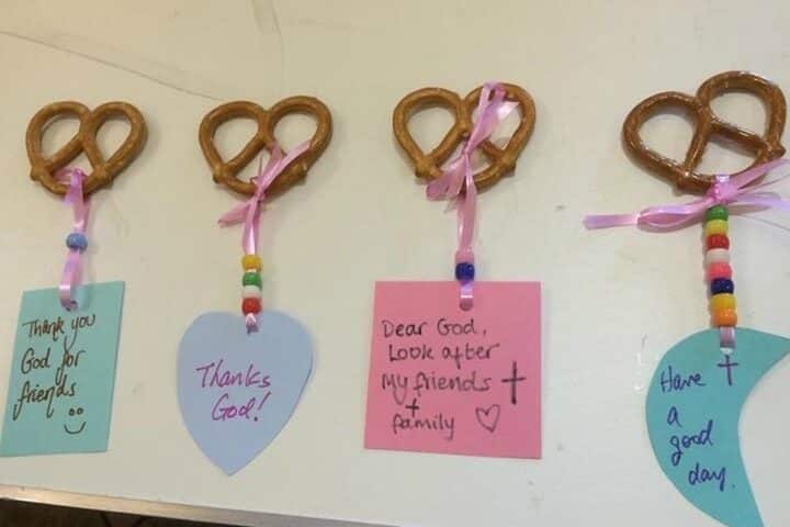 Children's prayers hung to pretzels