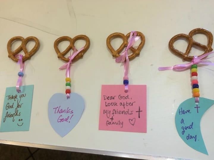 Children's prayers hung to pretzels