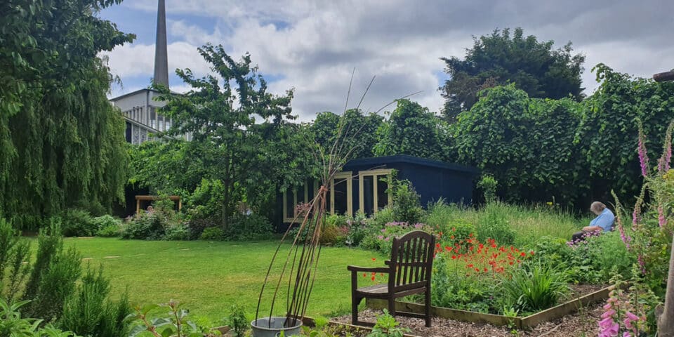 Quiet garden in Staines with church spire in the background