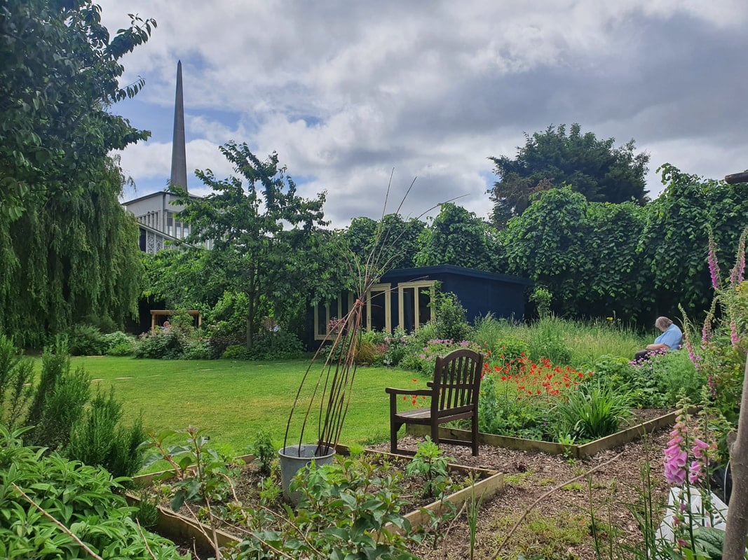 Quiet garden in Staines with church spire in the background