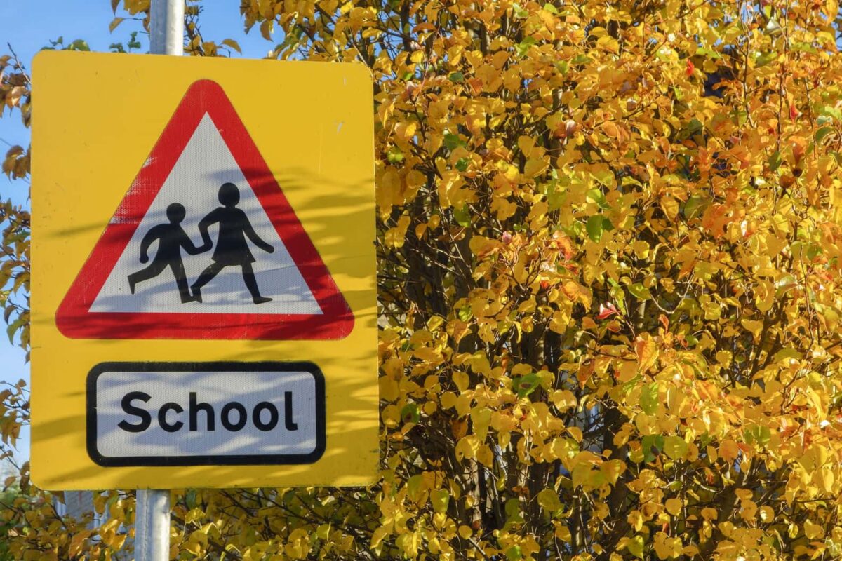 School warning sign in Autumn