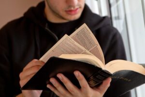 A young man reading the Bible