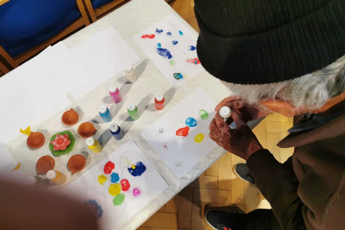 Guest at day centre creating art.