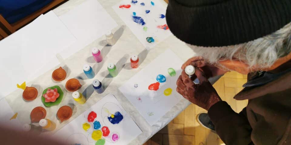 Guest at day centre creating art.