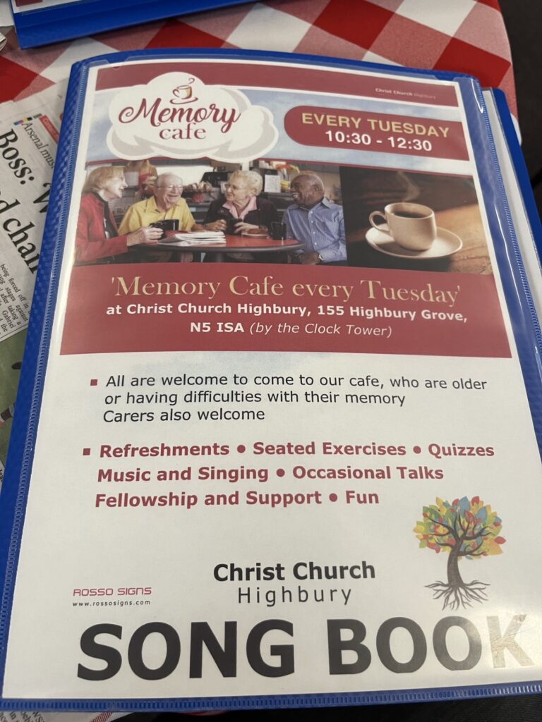 A copy of the “Christ Church Highbury Song Book” is laying on a table.