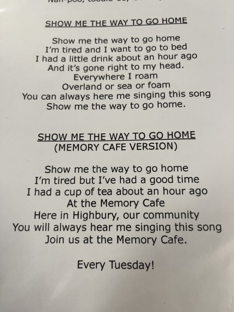 An extract from the Christ Church Highbury Song Book shows two versions of the song, “Show me the way to go home” - the original, and the “Memory Café Version” with altered lyrics.