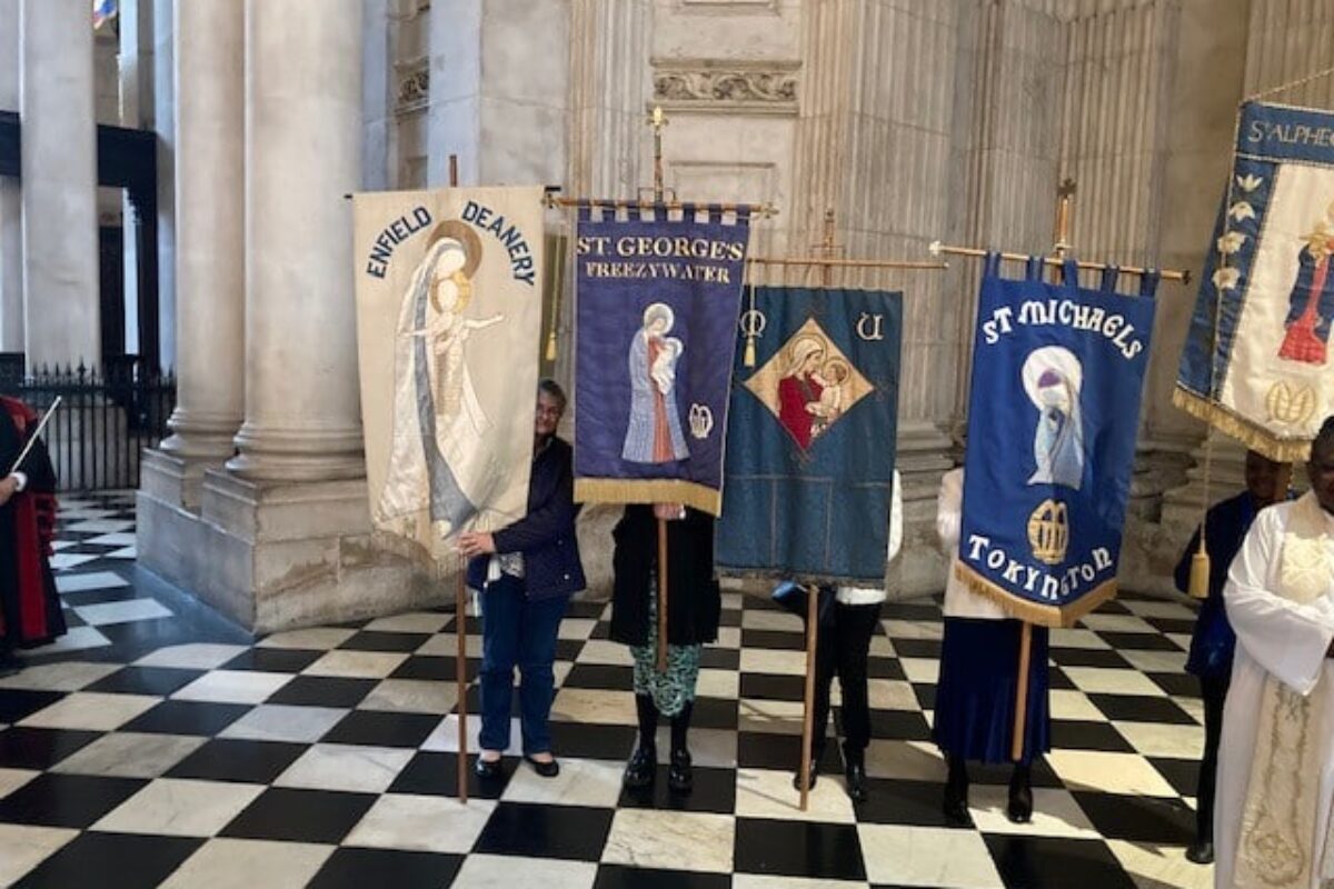 People holding banners at the Mother's Union service