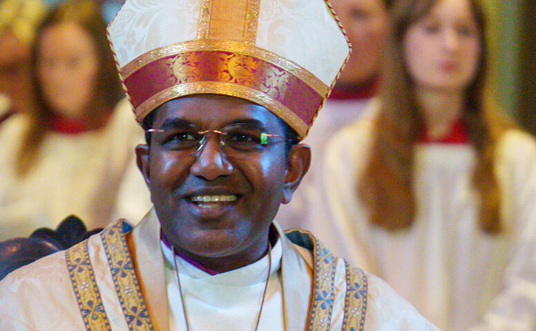 Bishop Anderson in Bishops hat and gown in portrait style photo