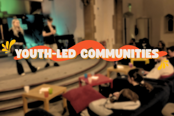 Blurred image of a youth group with the words 'youth-led communities'