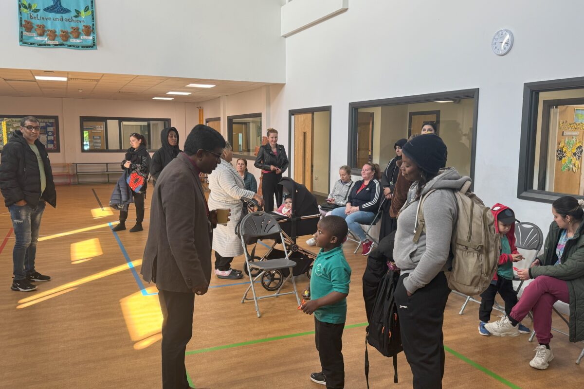 Bishop Anderson talking to school children