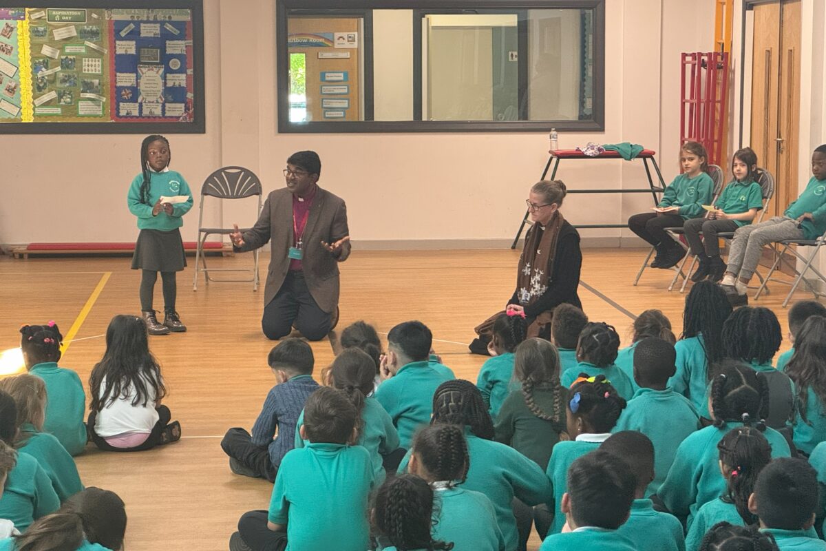Bishop Anderson talking to school children