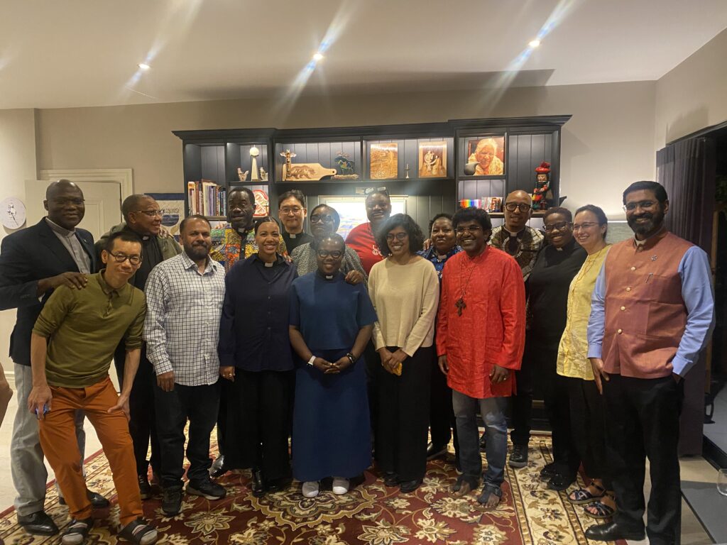 Winnie Varghese with a group of clergy