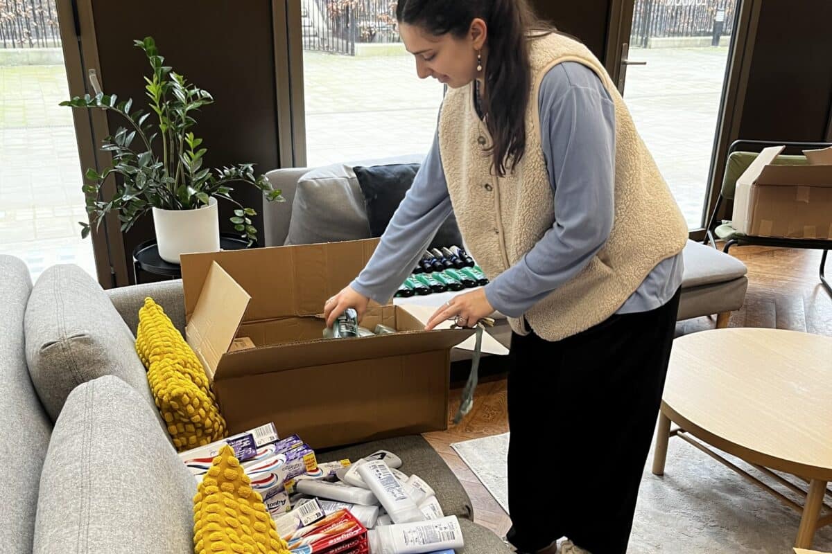 woman sorting through products for a church drop in
