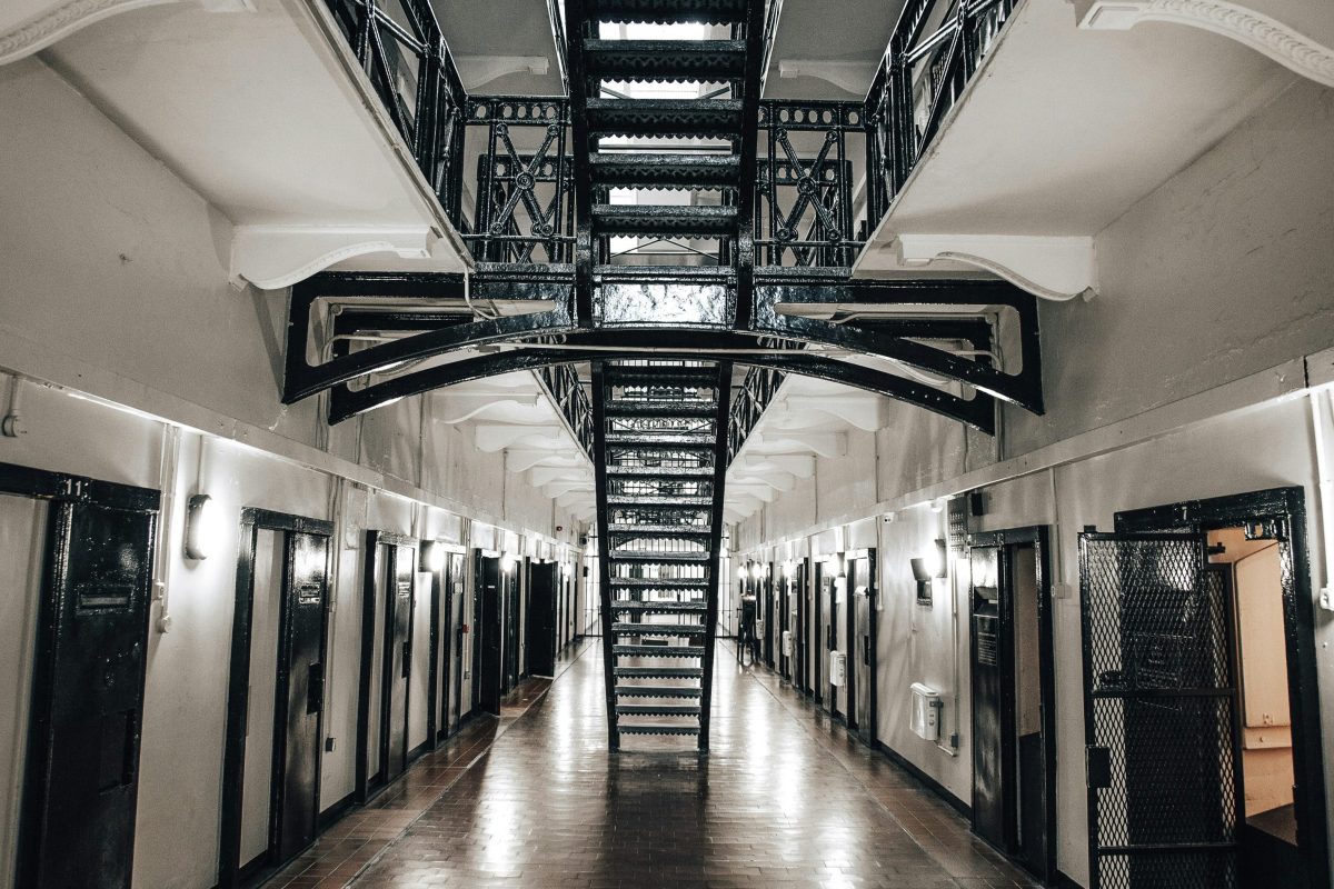 an open plan prison corridor and stairs